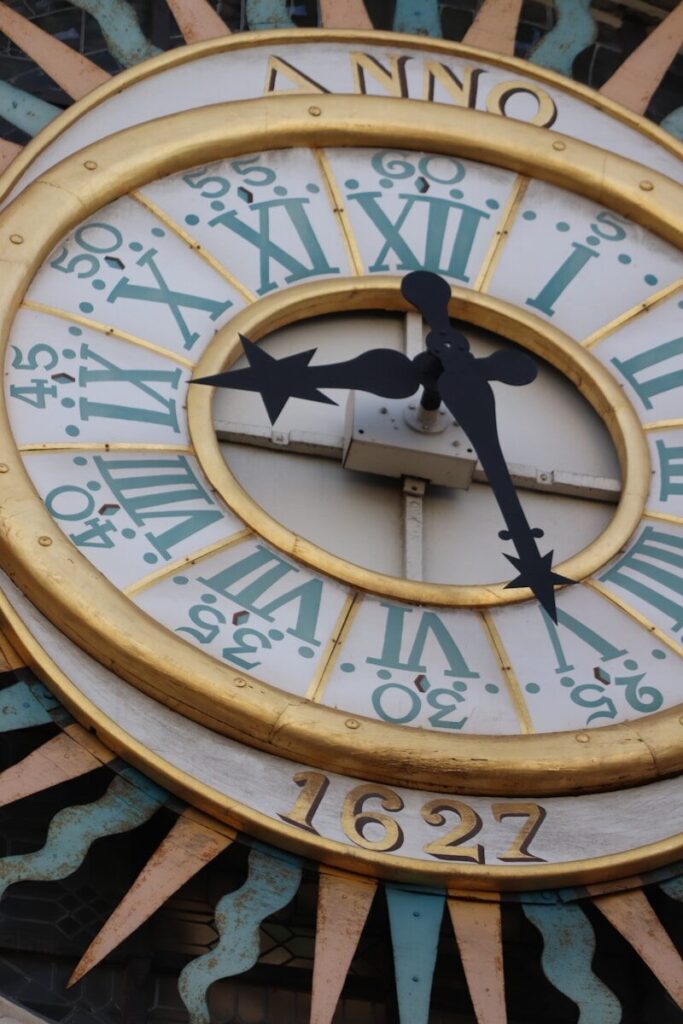 Close-up of a detailed antique clock face.